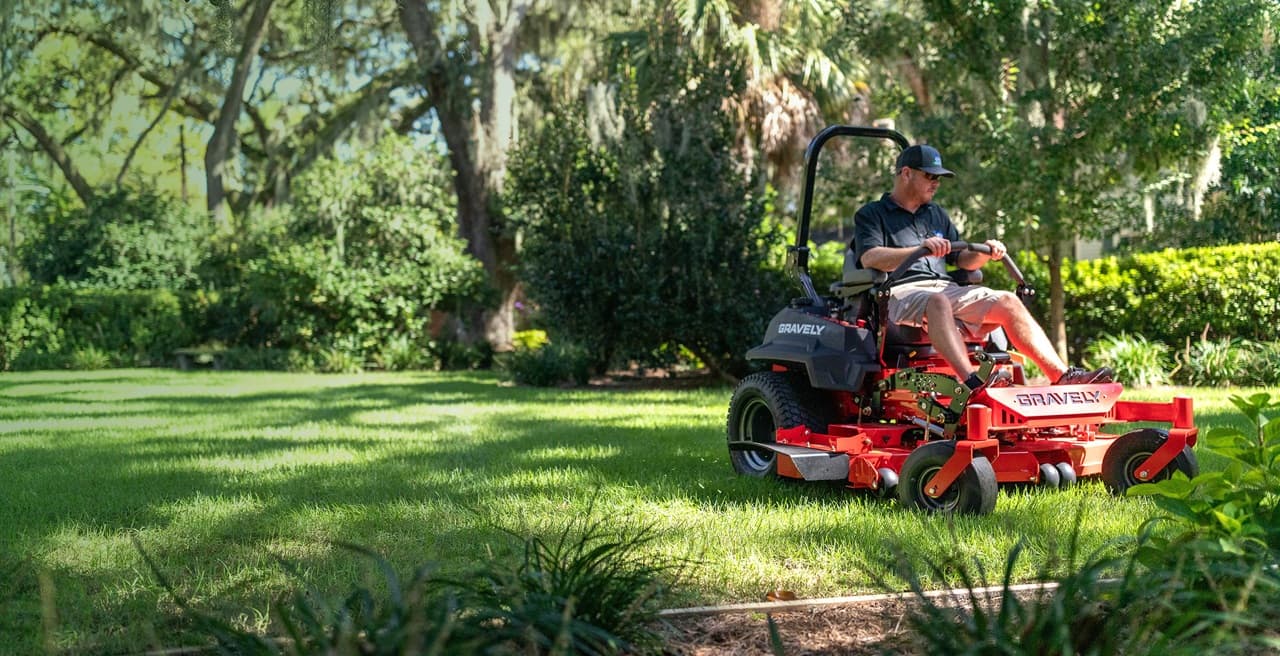 Lawn care professional operating a commercial mower